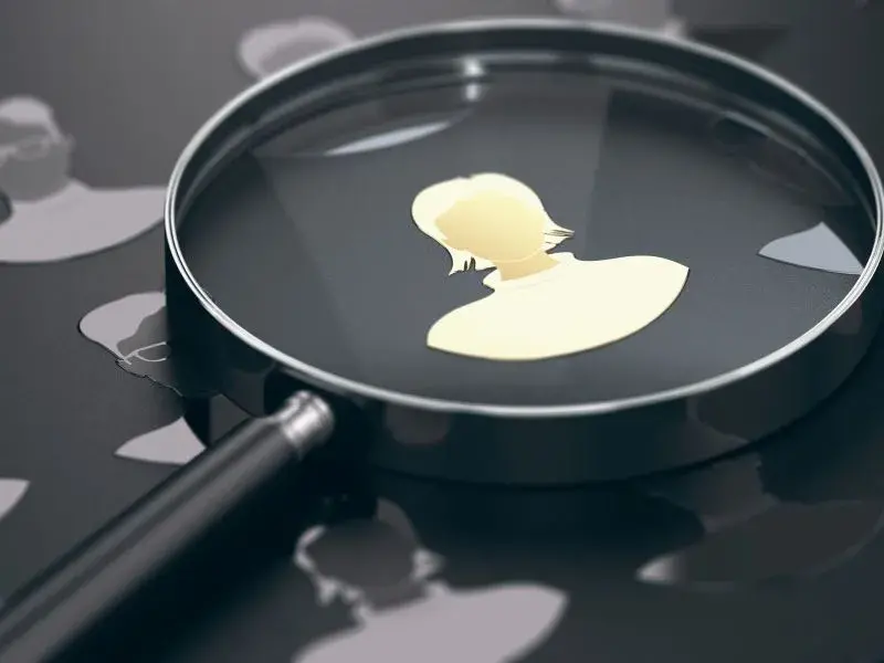 Magnifying glass over profile - Job search - Career Guru